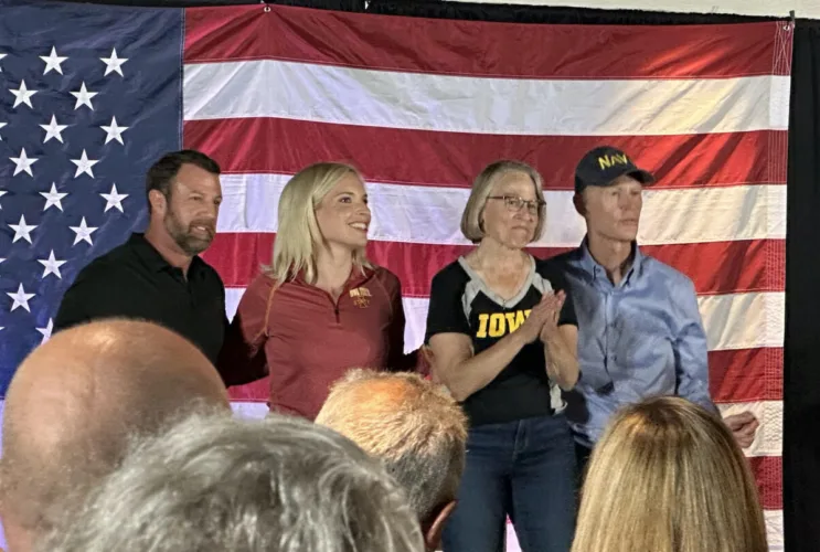 Iowa, national politicians court voters at CyHawk tailgates